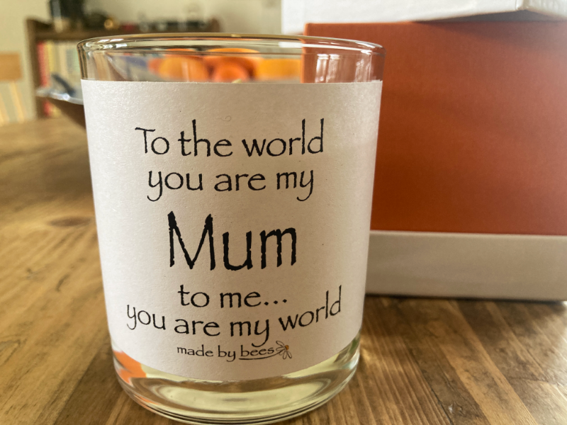 votive candle with label that says to the world you are my mum to me you are my world
