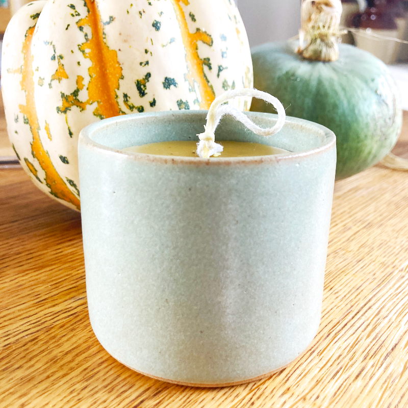 beeswax candle in ceramic pot