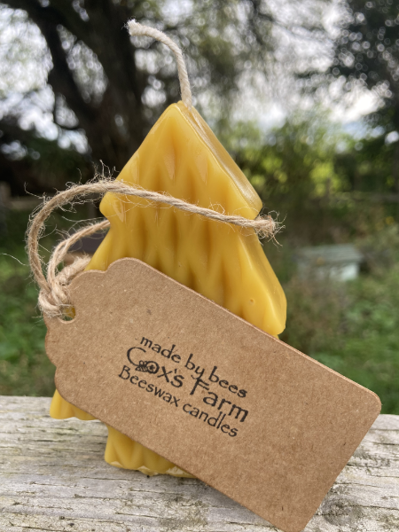 festive candle with coxs far beeswax candles tag