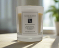 Load image into Gallery viewer, luxury candle in foreground with made by bees label
