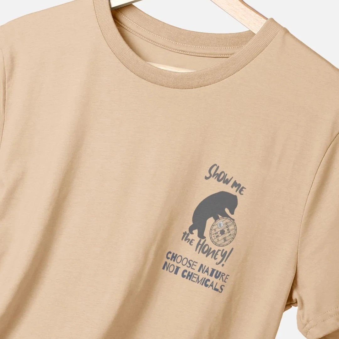 Beige t-shirt with show me the honey design on a hanger