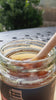 Taif rose honey drizzling in sunlight